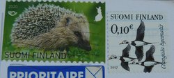 finnish stamps of a hedgehog and long-tailed ducks