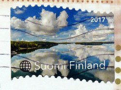 finnish postage stamp lake and sky reflection