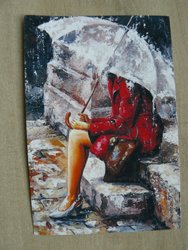 Postcard girl in red coat sitting in rain with umbrella