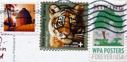 three u.s. postage stamps with a hiking postage stamp