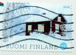 postage stamp finland log cabin in the snow